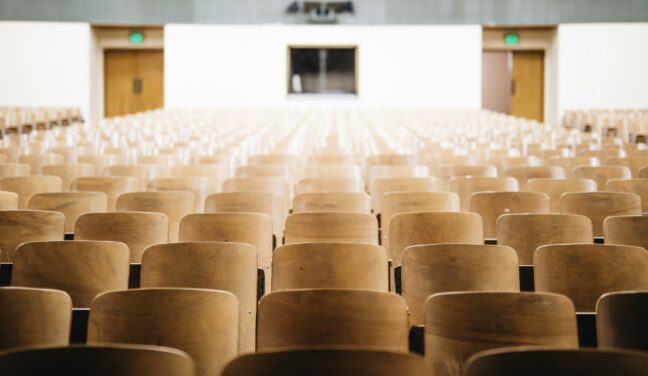 rows of empty seats in an auditorium
